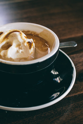affogato in black and white cup with plate
