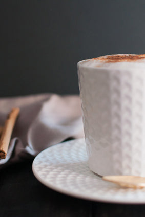 cinnamon cappuccino in white porcelain cup