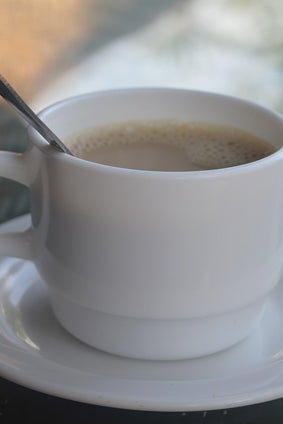 au lait coffee in white cup with spoon