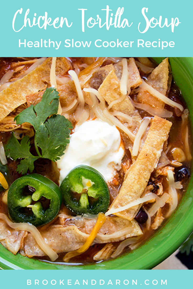 Close-up of a bowl of tortilla soup with jalapeno and sour cream