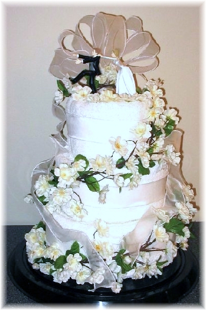 White and Silver Towel Cake