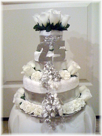 White and Silver Towel Cake