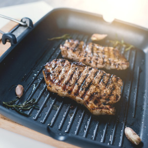 Seasoned cast iron skillet grilled with steak