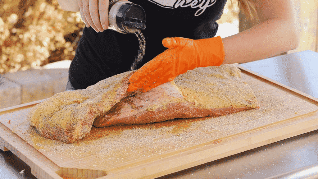 Hey Grill Hey Beef Spices sprinkled on beef brisket.