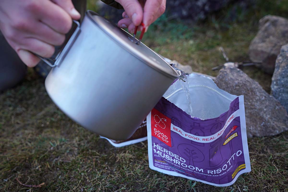 Backpacking food (pouring water into pouch)