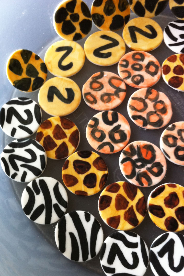 DIY cupcakes made of fondant and painted in a safari jungle animal themed design.