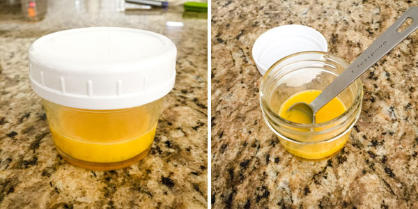 Beaten egg in a mason jar with a lid and teaspoon measuring spoon.