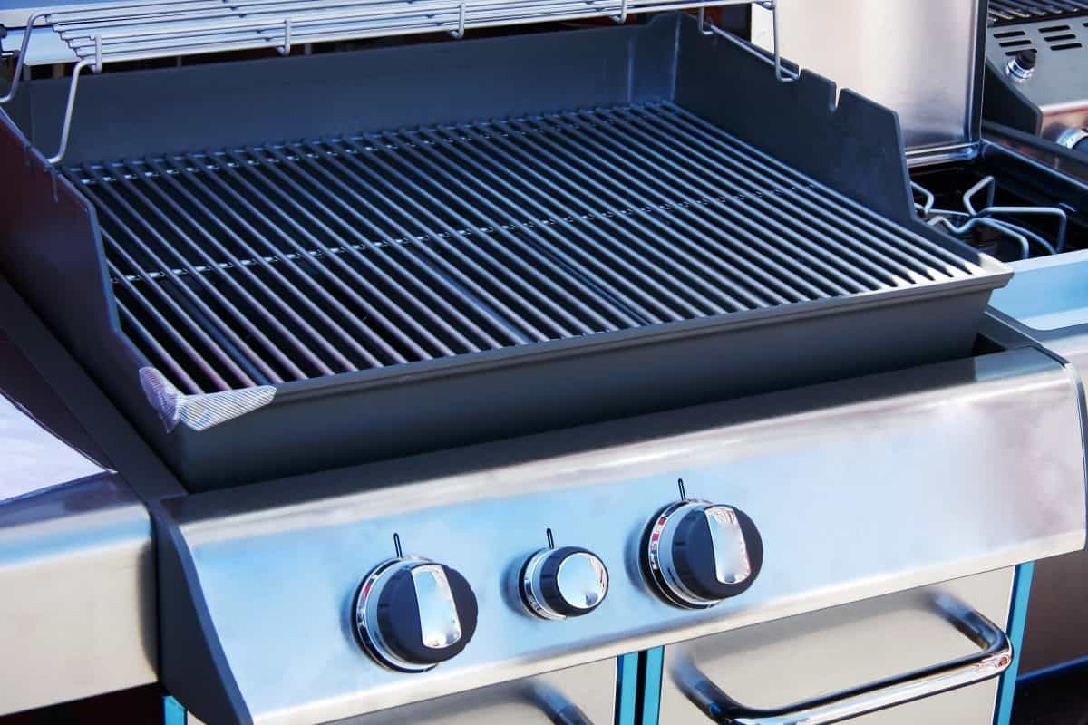 Brand new gas grill with open lid