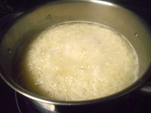 close-up of rice boiling in water