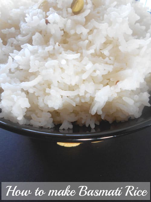Close-up of cooked rice in a black serving bowl