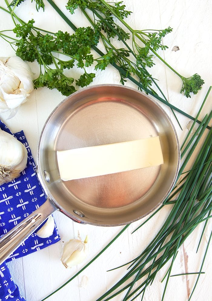 Garlic in a pan of melted butter.