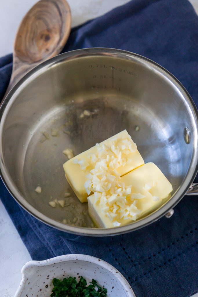 butter in a pan with garlic sauce