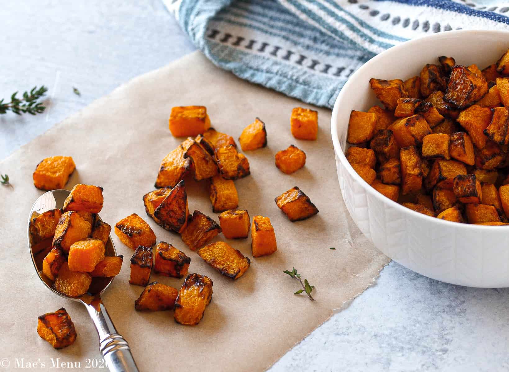 Pumpkin seed butter air fryer on a parchment with a spatula and in a white bowl