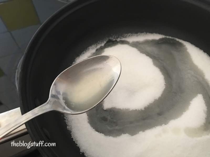 Sugar, lemon, salt and water in pan