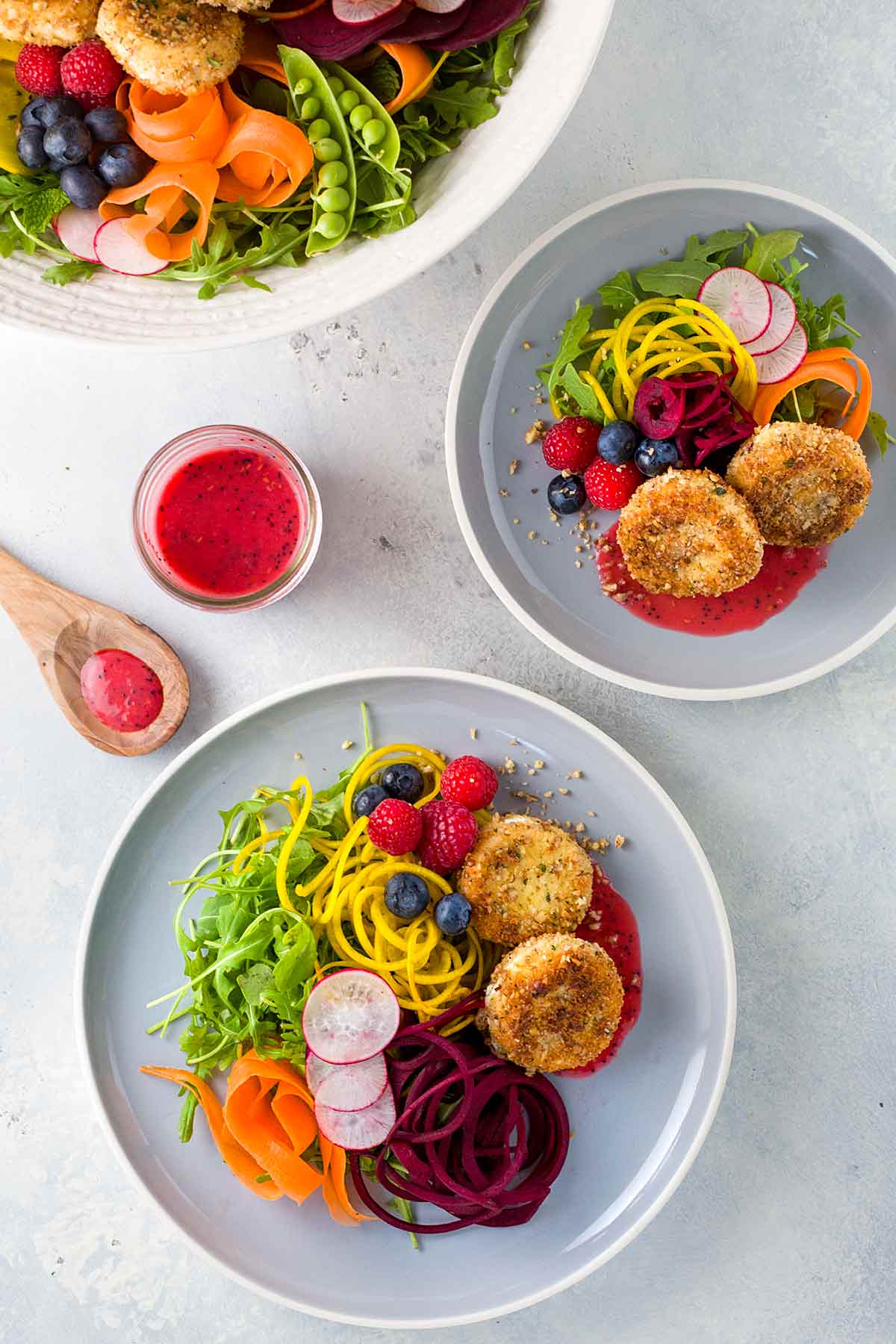 Crispy and delicious fried goat cheese salad recipe with fresh veggies, arugula, beets, carrots, peas, avocado and raspberry poppy seed sauce. | takeoutfood.best