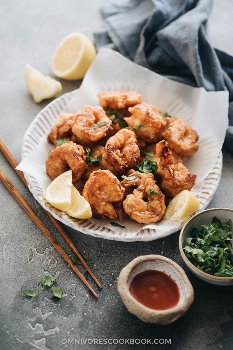 Place fried shrimp on a plate lined with parchment paper