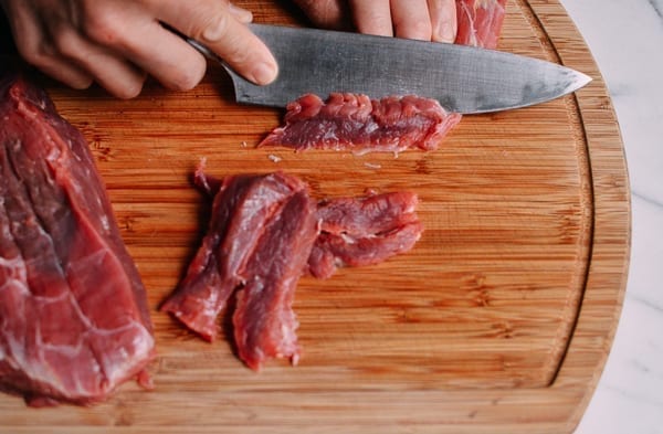 slice beef rib steak on the cutting board of takeoutfood.best