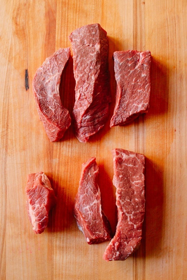 Grilled beef slices on the cutting board of takeoutfood.best