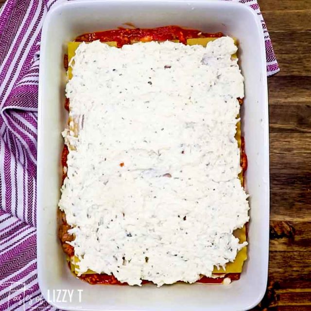 Layer lasagna in a baking pan