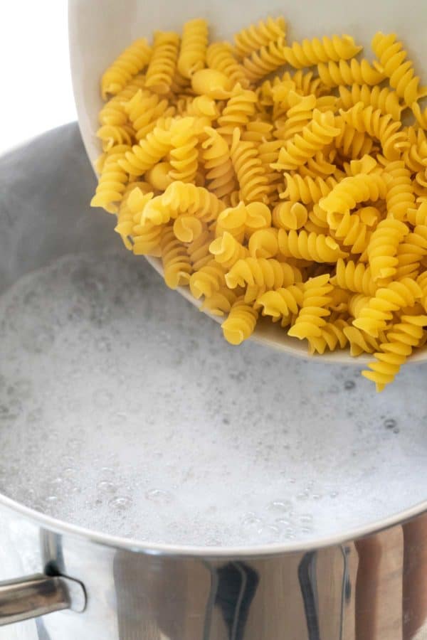 Pour the pasta into the pot of boiling water