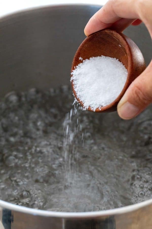 Pour salt into a pot of boiling water