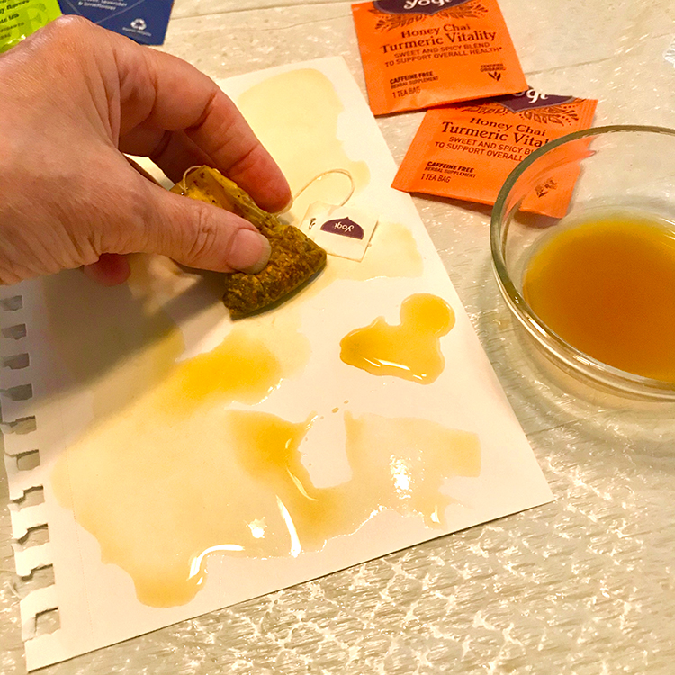 Paper stains by rubbing with wet tea bags
