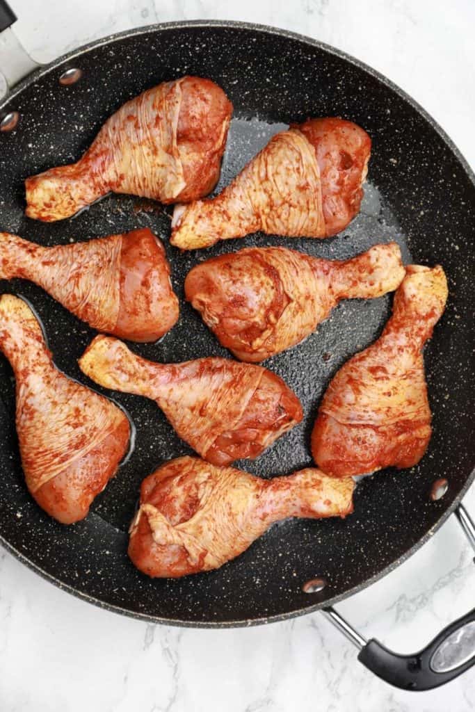 Chicken arranged in the pan.