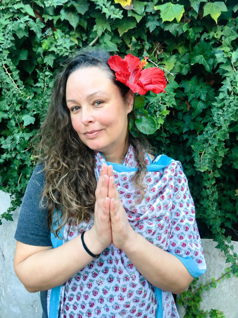 girl drinking hibiscus tea is praying