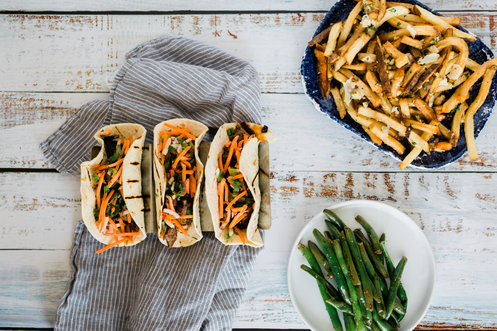 tacos with fries and beans on a white table san antonio riverwalk restaurants