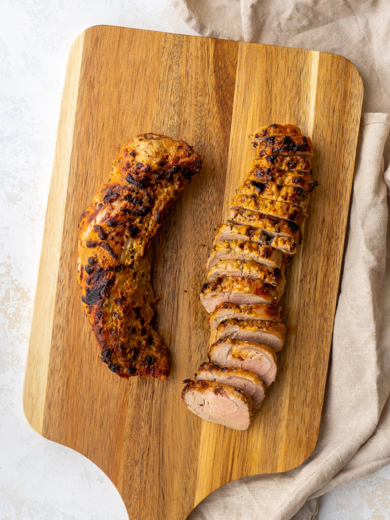 Aerial view of sliced ​​pork loin on air frying on cutting board