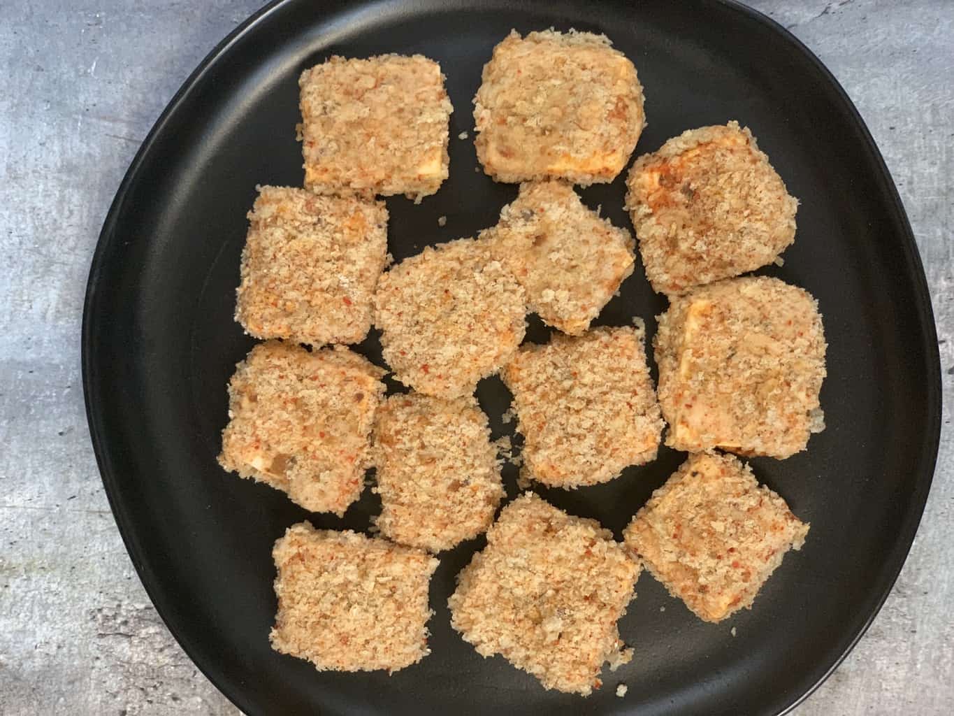 Cover with breadcrumbs and seasonings and place on a plate