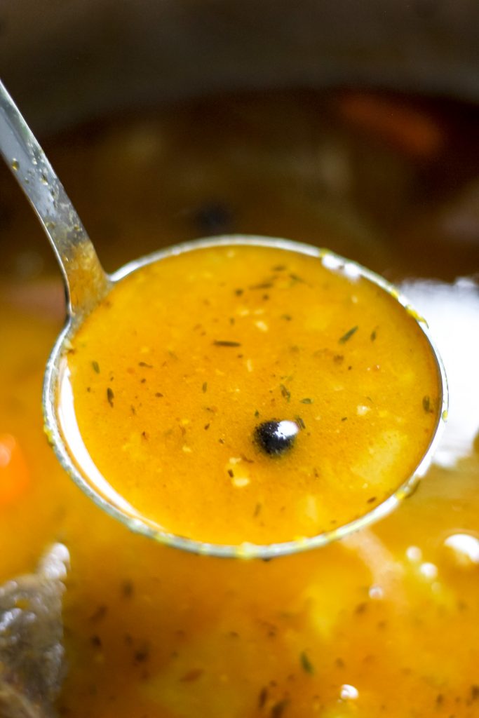 Traditional Jamaican Pumpkin Beef Soup in a Bowl