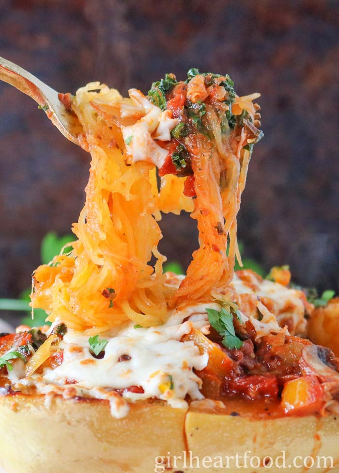 Several squash spaghetti dishes from a boat of stuffed spaghetti squash.