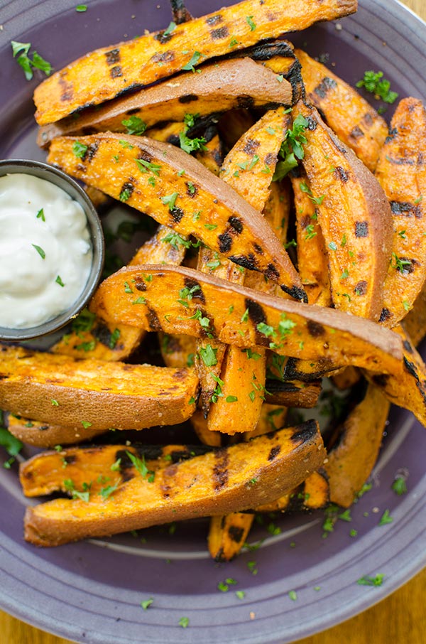 Season the baked sweet potato with dill and cilantro. | takeoutfood.best