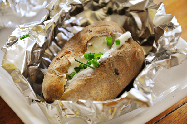 Baked potatoes on bbq