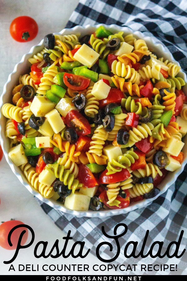 This simple pasta salad recipe is made with tricolor rotini, Italian dressing, mozzarella cheese, bell peppers, black olives, and cherry tomatoes. Friend