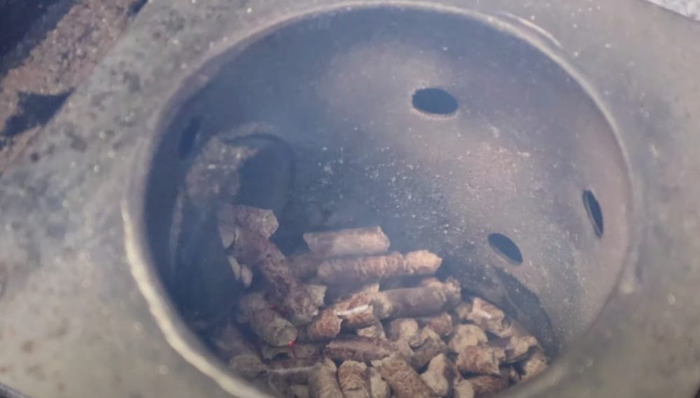 pellets ignite in the fire pit of a traeger pellet oven