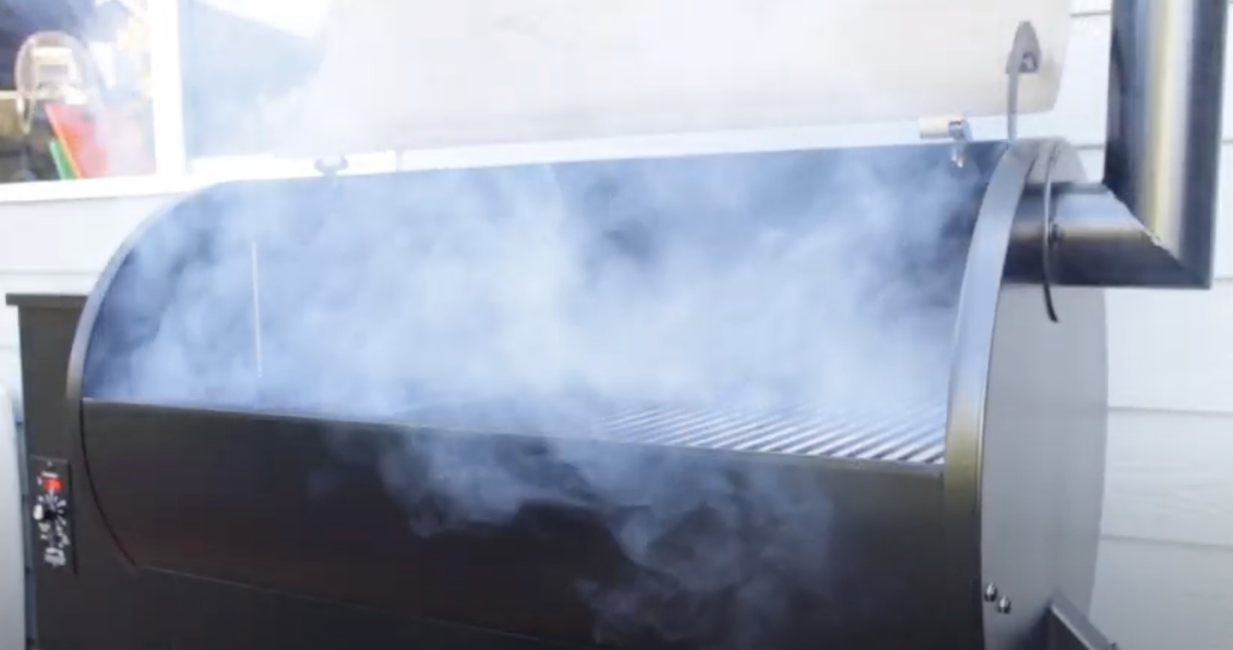 a traeger oven begins to smoke