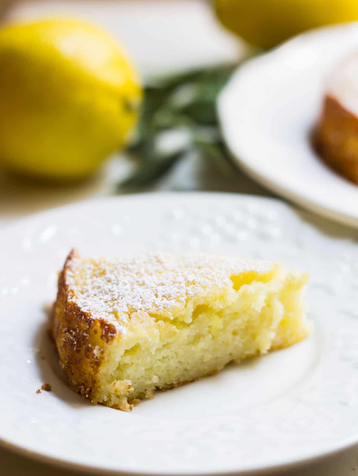 Lemon ricotta cake close up slice image on plate