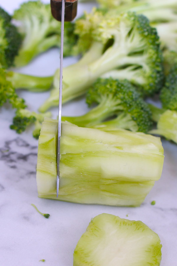 Cut the peeled broccoli stem into thin slices