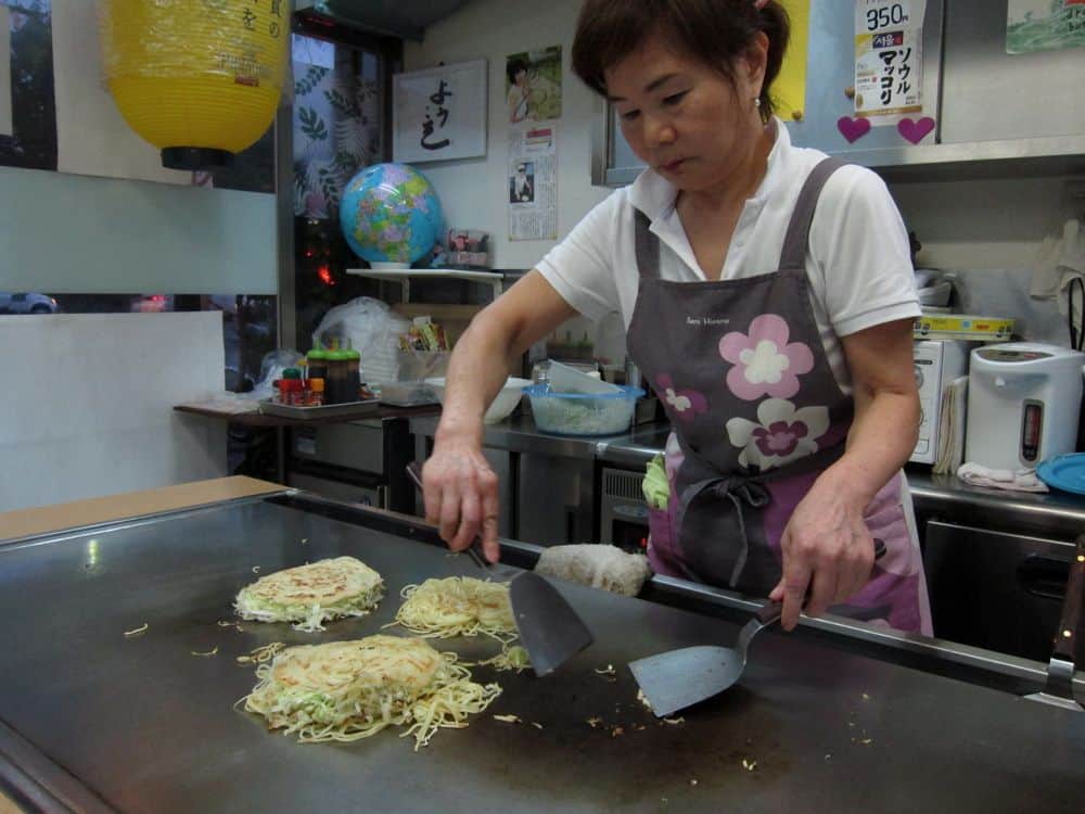 Okonomiyaki being made at Rie, Hiroshima
