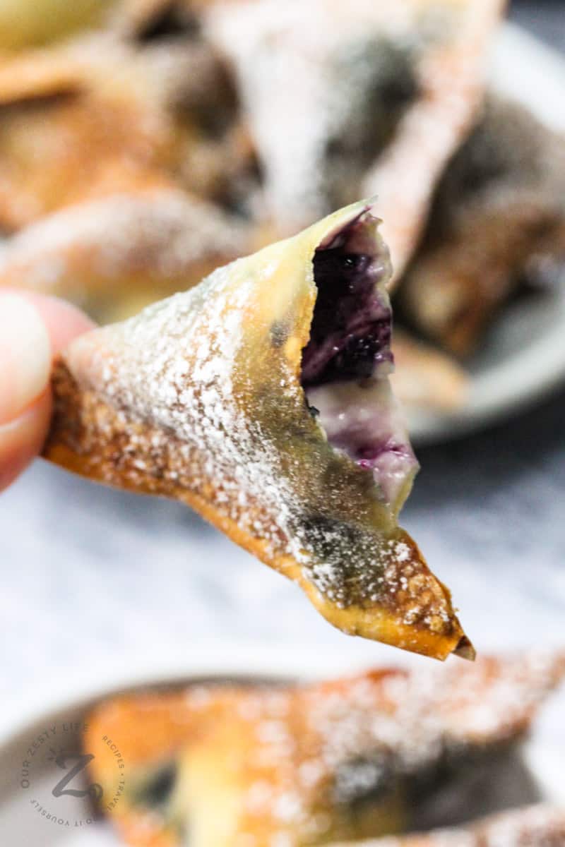 Air Fryer Blueberry Wontons in half for filling