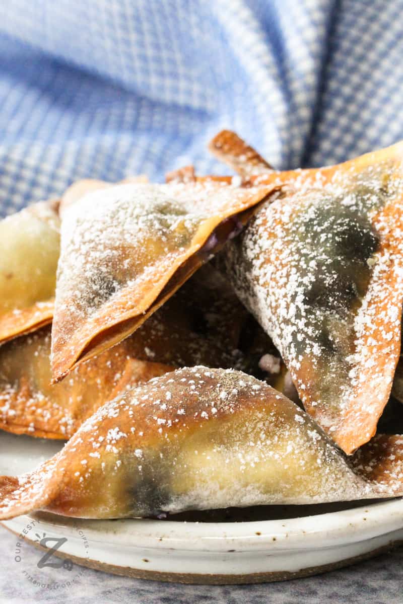 Close-up of Air Fryer Blueberry Wontons on a plate