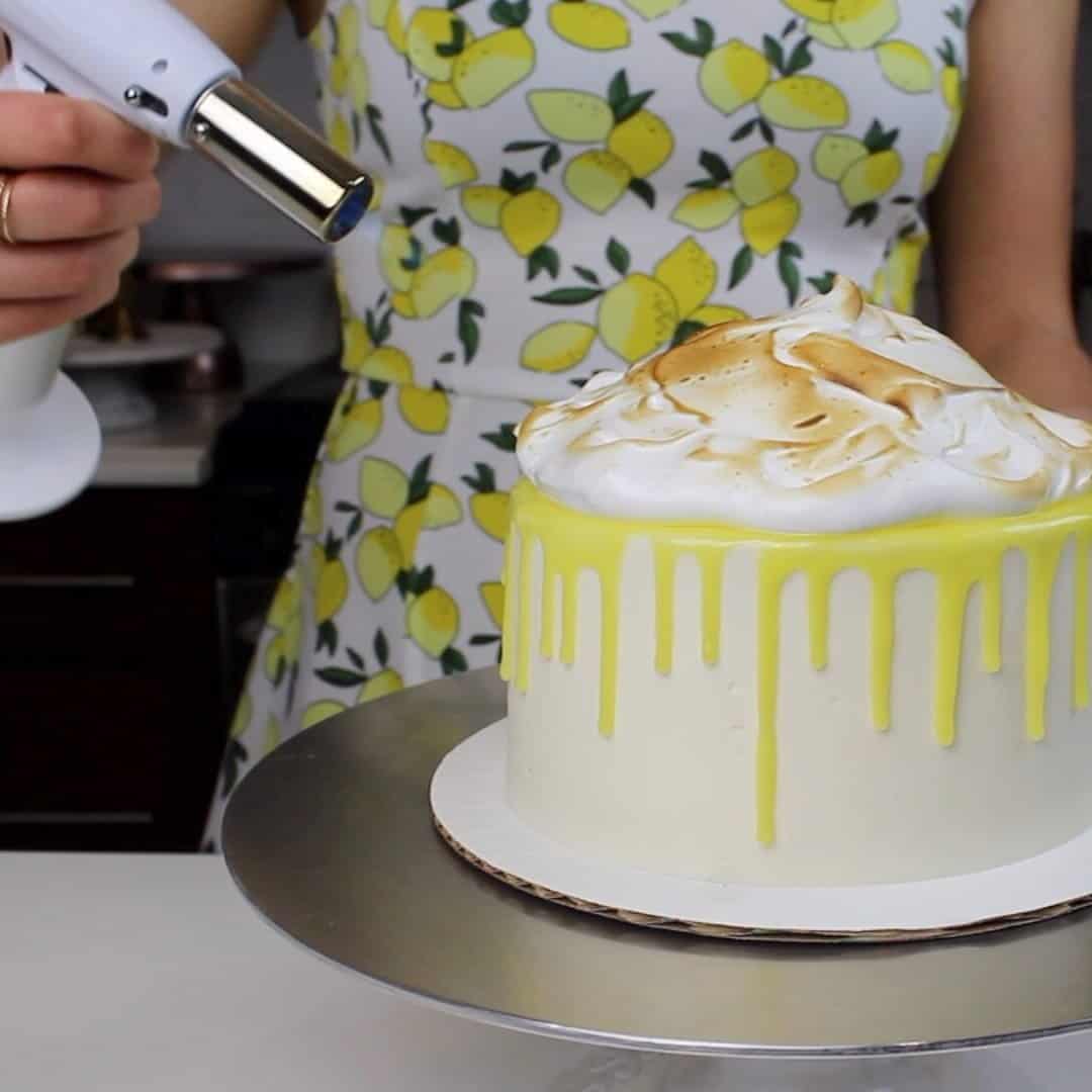 Photo of a croissant on top of a lemon meringue drip