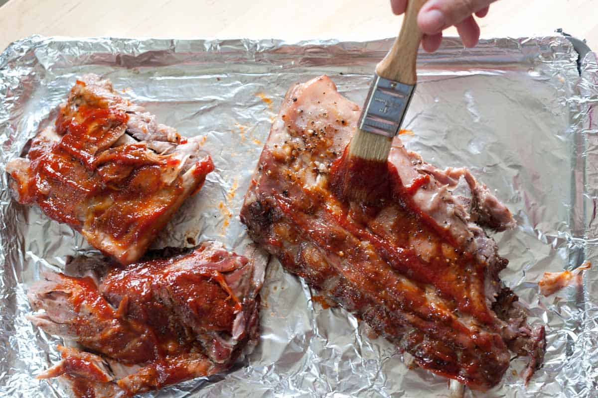 Brush the sauce over the ribs