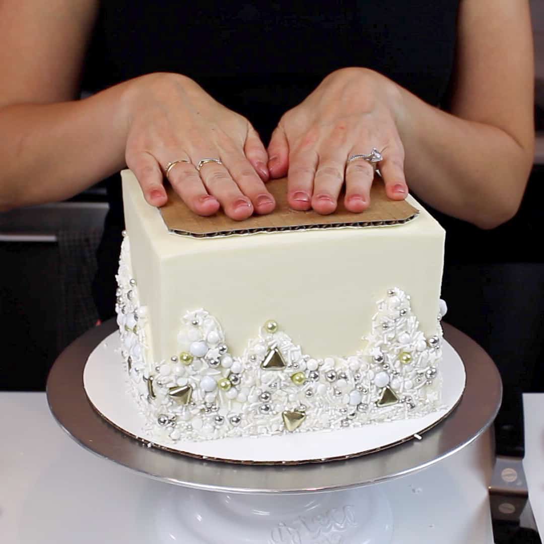 image of an easy to use method to add fresh flowers on a cake