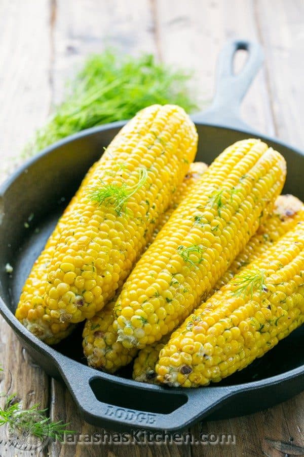 Baked corn covered in foil with dill lemon butter