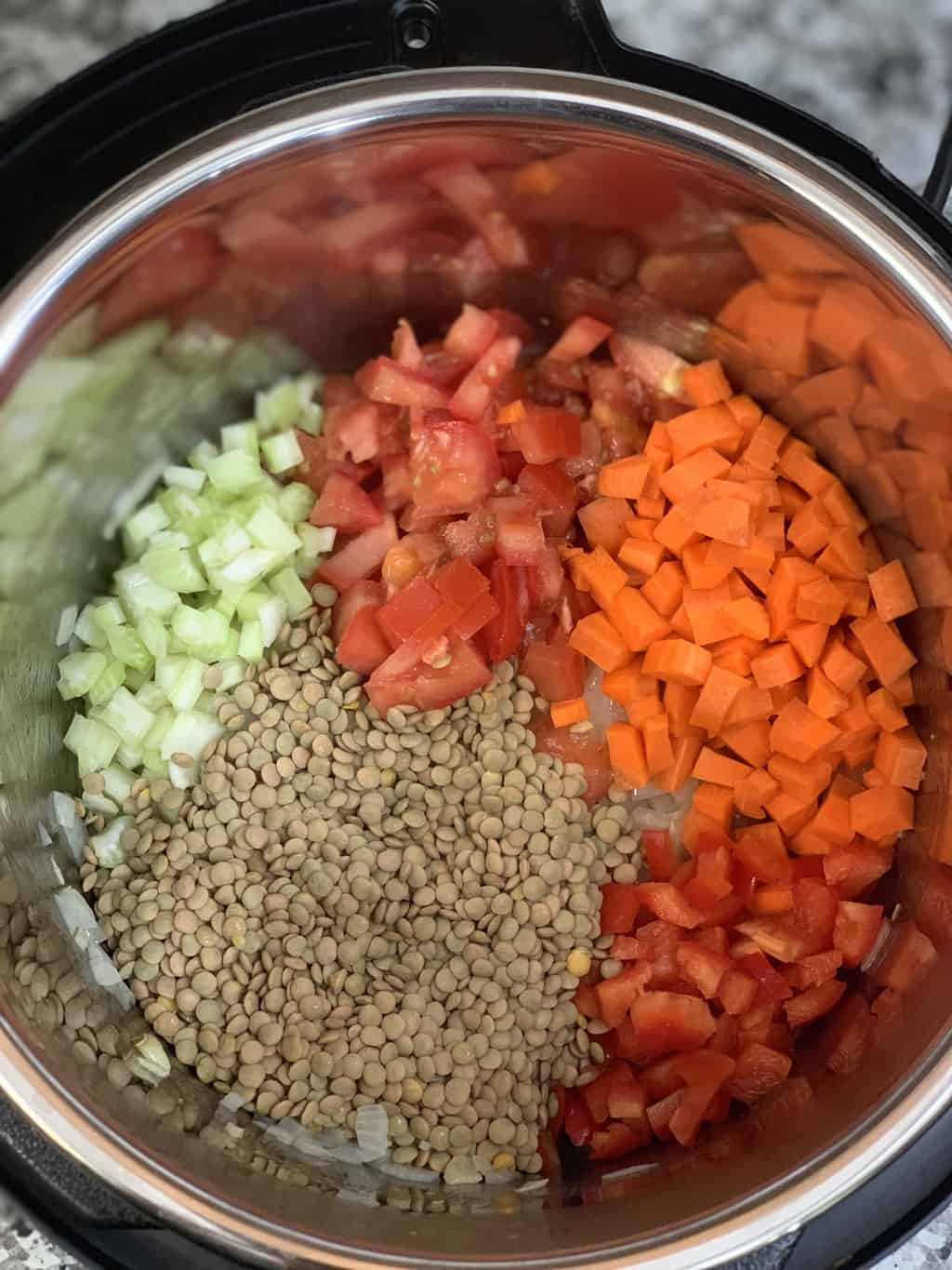 Steps to add vegetables like celery tomatoes carrots bell peppers and green lentils