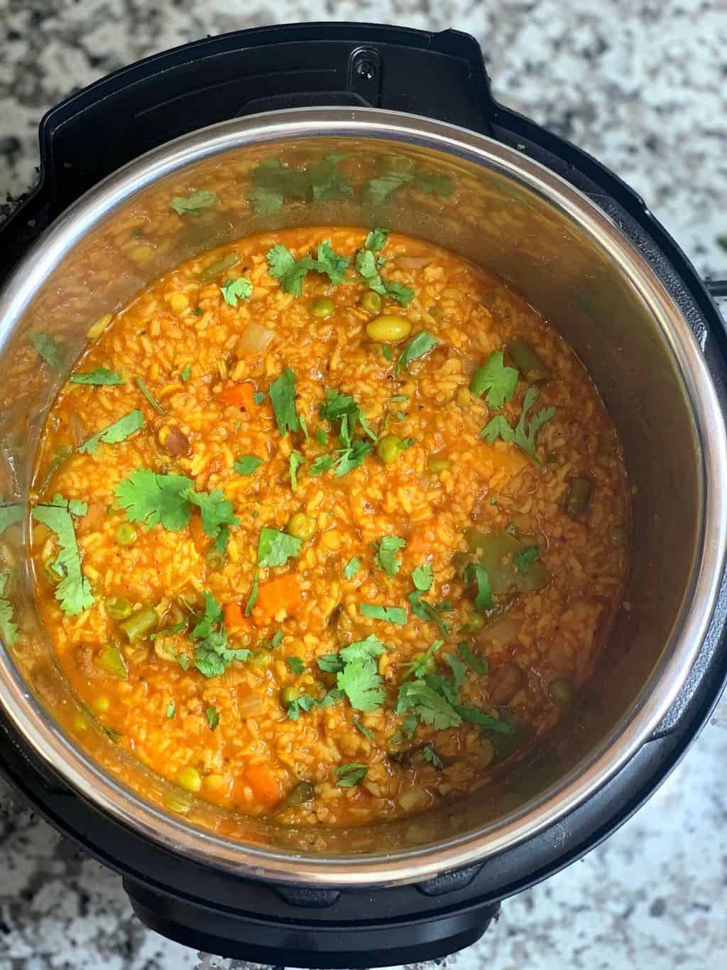 instant bath bisi bele in pots garnish with coriander leaves