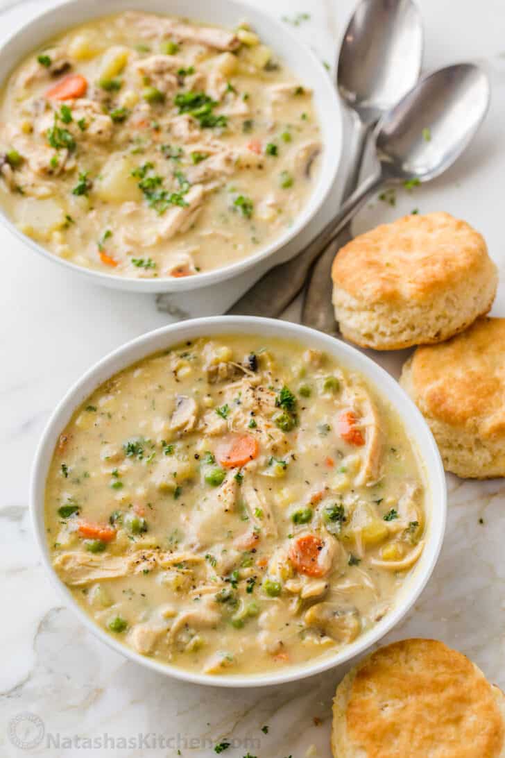 Chicken soup served with biscuits
